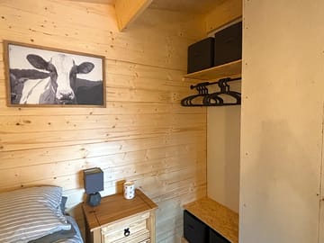 Bedroom with storage and hanging space