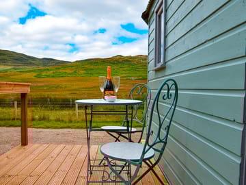 Bistro table and chairs for outdoor dining on the decking