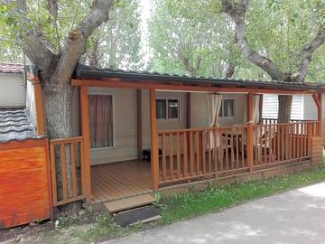 Cabins with a verandah and outdoor furniture