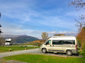 Campervan pitch with hardstanding, grass for awning and electric hook up