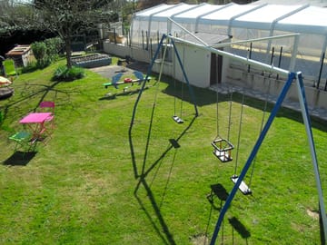 The playground and covered swimming pool