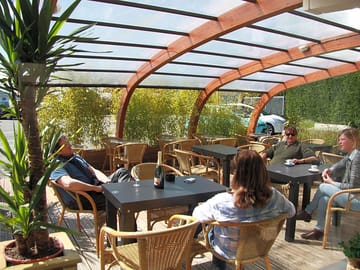 Relax in the bar's cosy terrace with a cool drink