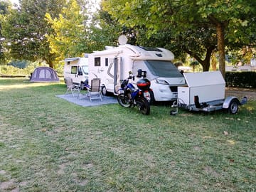 Motorhome pitch on grass and gravel with electricity