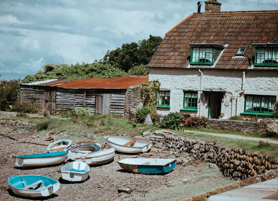 Boats on the shore at Porlock Weir (Annie Spratt/Unsplash)
